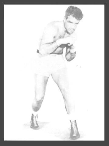 A black and white photo of a man in shorts.