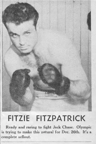 A black and white photo of an old boxing match.