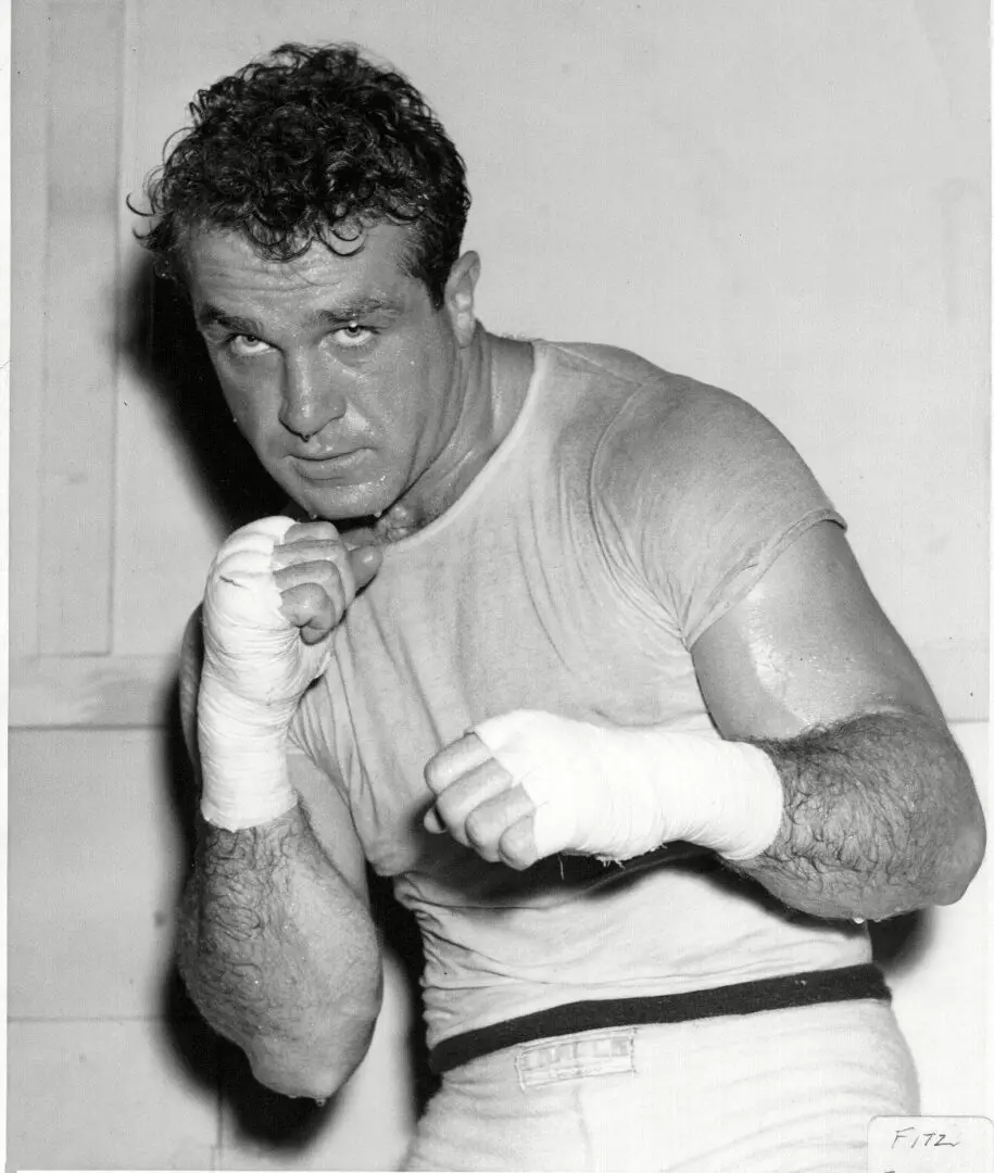 A man with bandages on his hands and wrist.