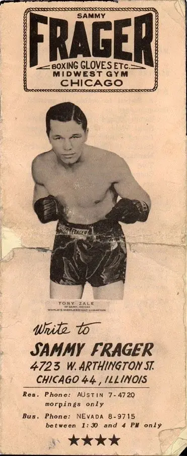 A black and white photo of a man in boxing gear.