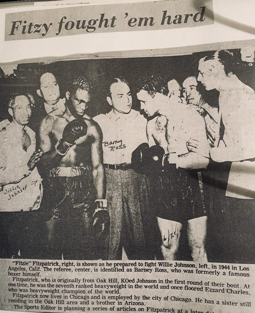 A newspaper photo of the boxers in their uniforms.